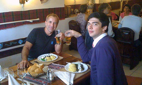 Ovidiu and I enjoy an Ursus (Bear) beer and lunch consisting of polenta with pork wrapped in grape leaves.